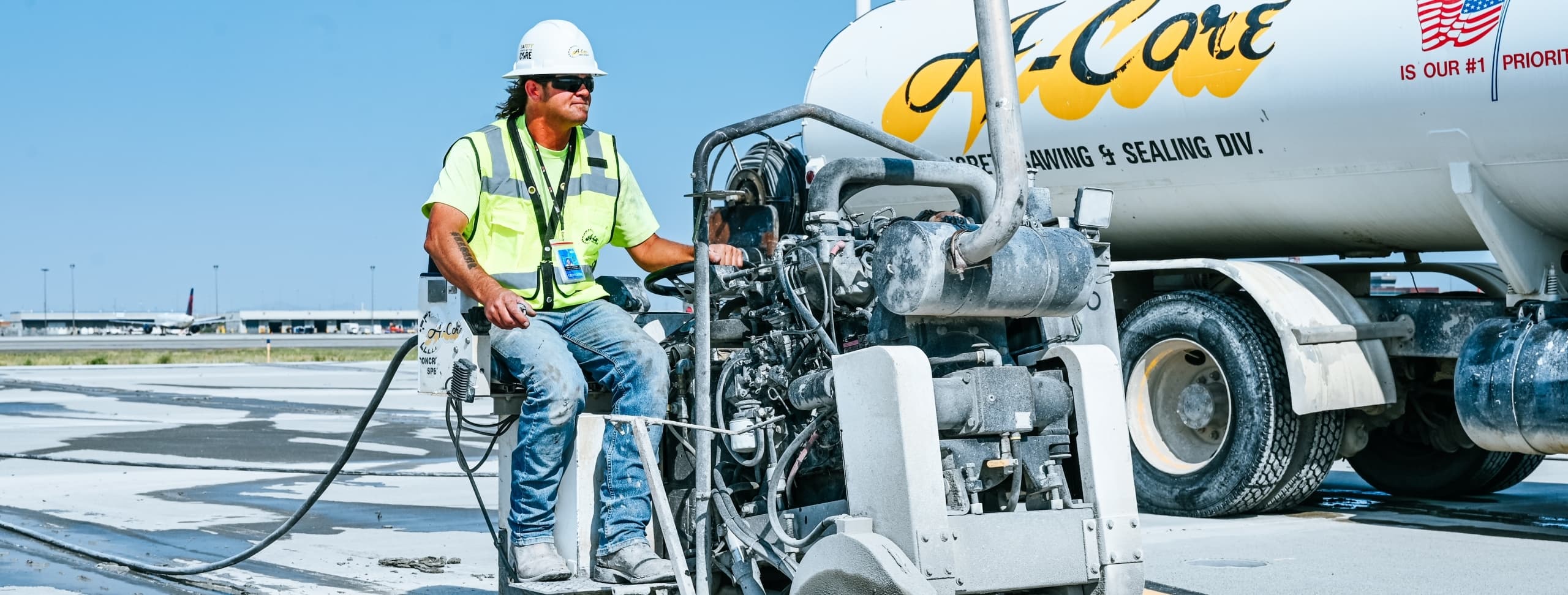 specialist working on concrete with machinery